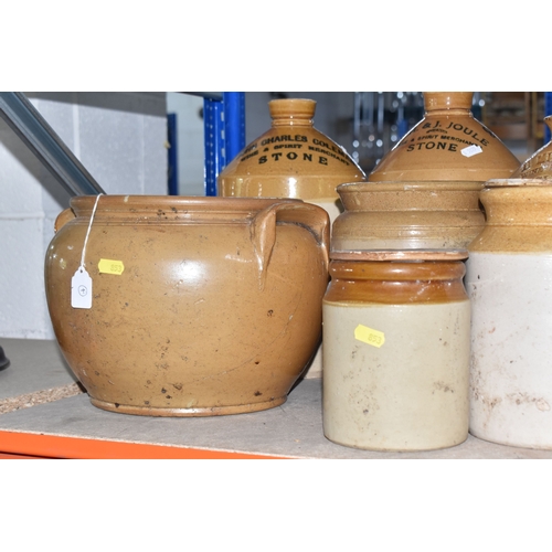 853 - A COLLECTION OF MAINLY STONEWARE PIECES to include four wine merchant flagons from John Charles Cole... 