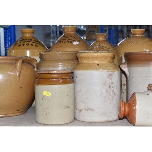 853 - A COLLECTION OF MAINLY STONEWARE PIECES to include four wine merchant flagons from John Charles Cole... 