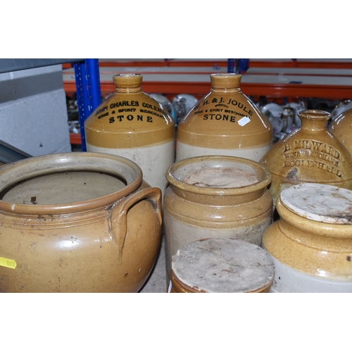 853 - A COLLECTION OF MAINLY STONEWARE PIECES to include four wine merchant flagons from John Charles Cole... 