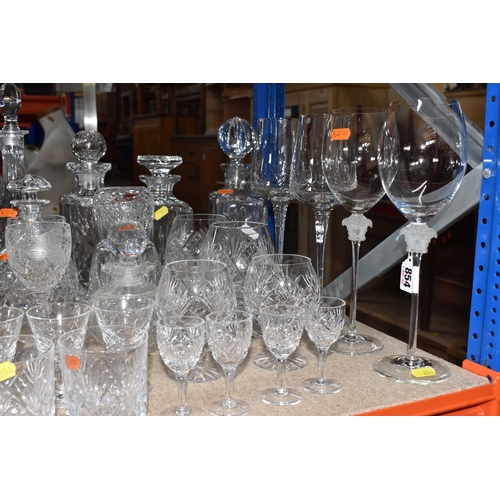 854 - A LARGE GROUP OF CRYSTAL AND GLASS DRINKING VESSELS to include two long stemmed Versace wine glasses... 