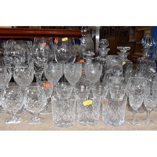 854 - A LARGE GROUP OF CRYSTAL AND GLASS DRINKING VESSELS to include two long stemmed Versace wine glasses... 