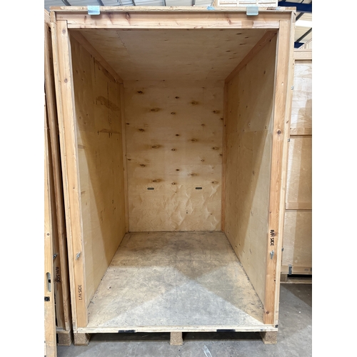 57 - AN INDUSTRY STANDARD WOODEN STORAGE CONTAINER, constructed from pine and plywood, on a pallet, width... 