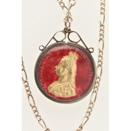 466 - AN 1887 SHILLING PENDANT, enamelled pendant in a white metal mount, suspended from a white metal fig... 