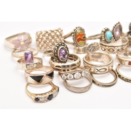 470 - AN ASSORTMENT OF SILVER AND WHITE METAL RINGS, to include a buckle ring, a wide textured band ring, ... 