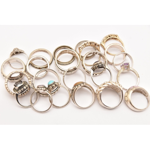 470 - AN ASSORTMENT OF SILVER AND WHITE METAL RINGS, to include a buckle ring, a wide textured band ring, ... 