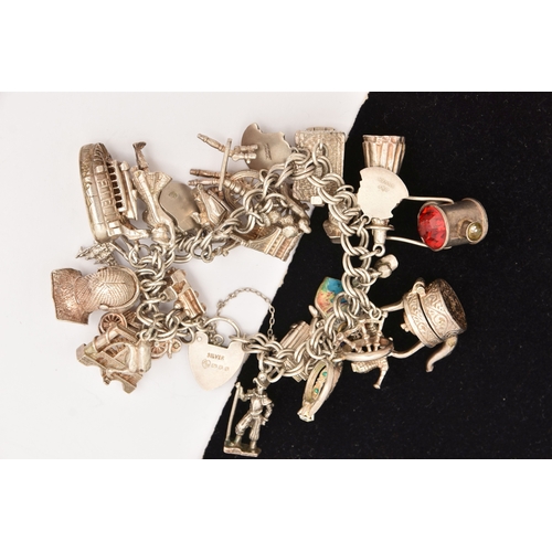 471 - A SILVER CHARM BRACELET, a silver double curb link chain bracelet fitted with a heart padlock clasp,... 
