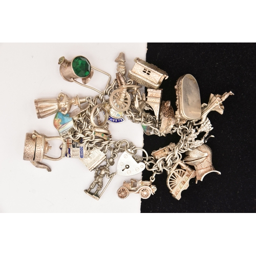 471 - A SILVER CHARM BRACELET, a silver double curb link chain bracelet fitted with a heart padlock clasp,... 
