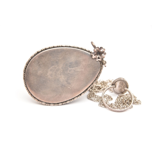 472 - A LARGE WHITE METAL BUTTERFLY WING PENDANT WITH RING, a large tear drop form pendant, fitted with a ... 