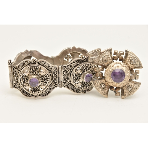 473 - A WHITE METAL BRACELET AND PENDANT, a large white metal bracelet designed and four panels with malta... 