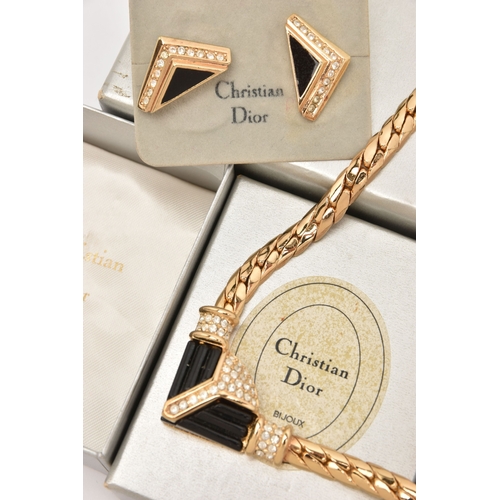 483 - THREE BOXED ITEMS OF COSTUME JEWELLERY ITEMS, to include a rose brooch signed 'Chr.Dior', a pendant ... 