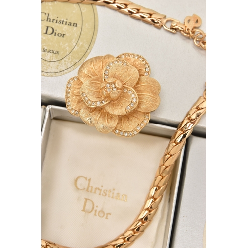483 - THREE BOXED ITEMS OF COSTUME JEWELLERY ITEMS, to include a rose brooch signed 'Chr.Dior', a pendant ... 