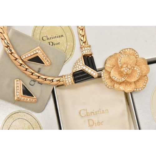483 - THREE BOXED ITEMS OF COSTUME JEWELLERY ITEMS, to include a rose brooch signed 'Chr.Dior', a pendant ... 
