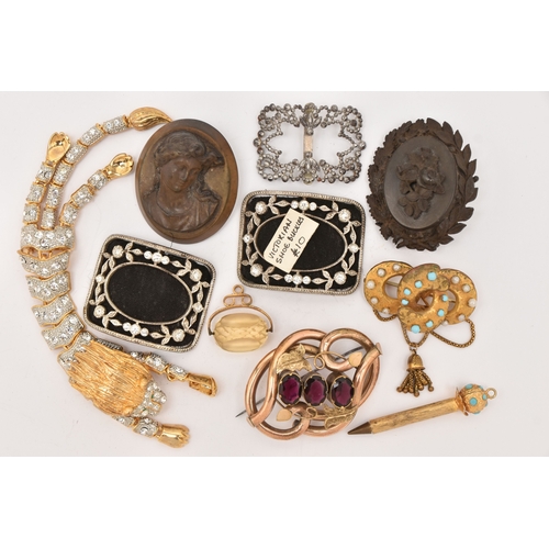 510 - AN ASSORTMENT OF ITEMS, to include a gold plated red paste set brooch, two carved vulcanite high rel... 