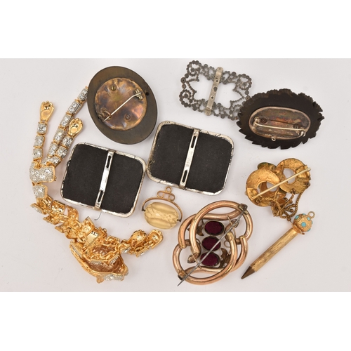510 - AN ASSORTMENT OF ITEMS, to include a gold plated red paste set brooch, two carved vulcanite high rel... 