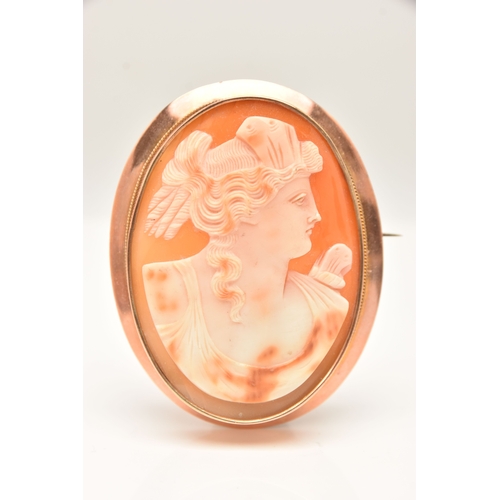 511 - A ROSE METAL CAMEO BROOCH, of an oval form, carved shell cameo depicting a lady in profile, collet s... 