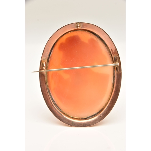 511 - A ROSE METAL CAMEO BROOCH, of an oval form, carved shell cameo depicting a lady in profile, collet s... 