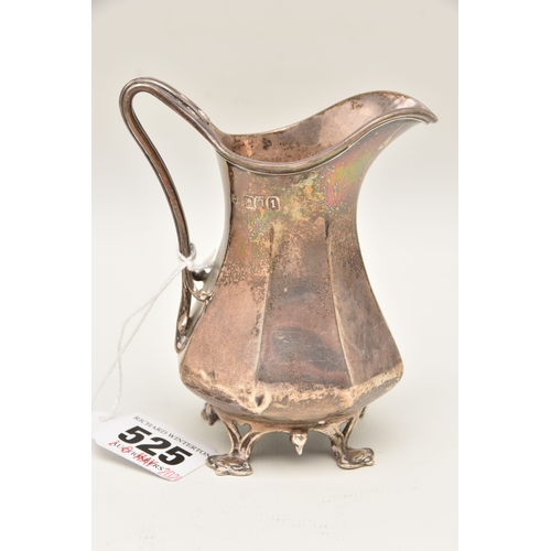 525 - AN EARLY 20TH CENTURY SILVER MILK JUG, faceted form with scroll handle, raised on four feet, hallmar... 