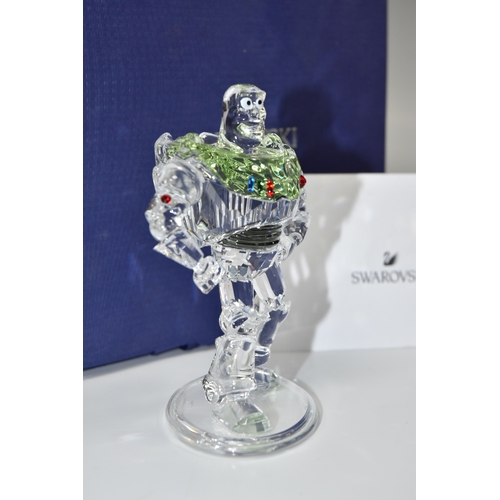 810 - A BOXED SWAROVSKI CRYSTAL TOY STORY 'BUZZ LIGHTYEAR' FIGURE, model no 5428551, the character from th... 