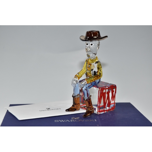 813 - A BOXED SWAROVSKI CRYSTAL TOY STORY 'SHERIFF WOODY' FIGURE, model no 5417631, the character from the... 