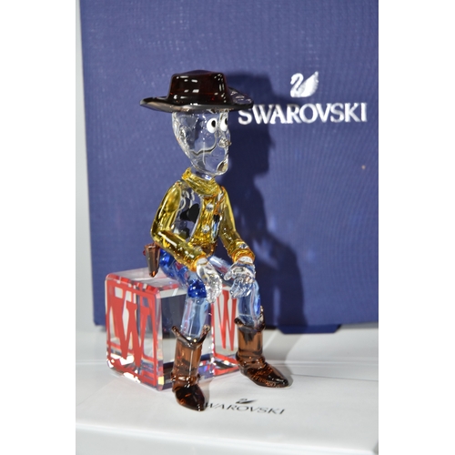 813 - A BOXED SWAROVSKI CRYSTAL TOY STORY 'SHERIFF WOODY' FIGURE, model no 5417631, the character from the... 