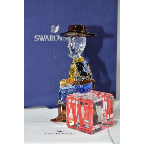 813 - A BOXED SWAROVSKI CRYSTAL TOY STORY 'SHERIFF WOODY' FIGURE, model no 5417631, the character from the... 
