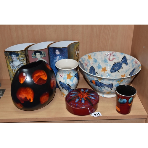 831 - A GROUP OF CERAMICS, comprising three pieces of Poole Pottery: a Galaxy pattern purse vase, height 1... 