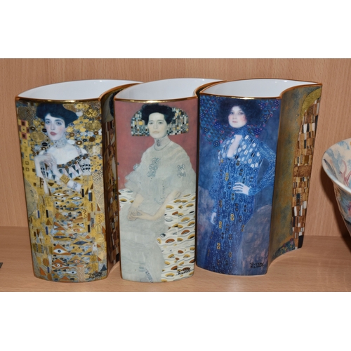 831 - A GROUP OF CERAMICS, comprising three pieces of Poole Pottery: a Galaxy pattern purse vase, height 1... 