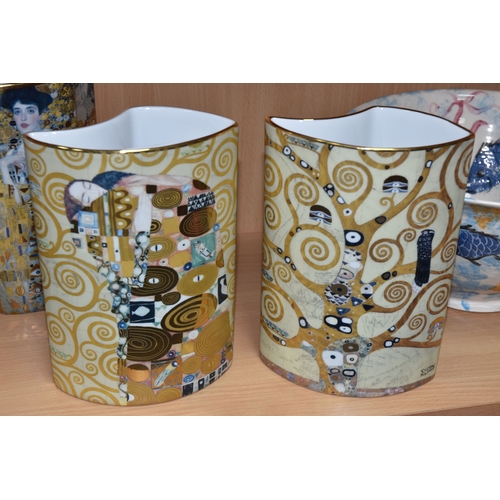 831 - A GROUP OF CERAMICS, comprising three pieces of Poole Pottery: a Galaxy pattern purse vase, height 1... 