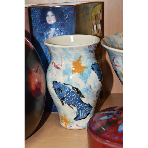 831 - A GROUP OF CERAMICS, comprising three pieces of Poole Pottery: a Galaxy pattern purse vase, height 1... 