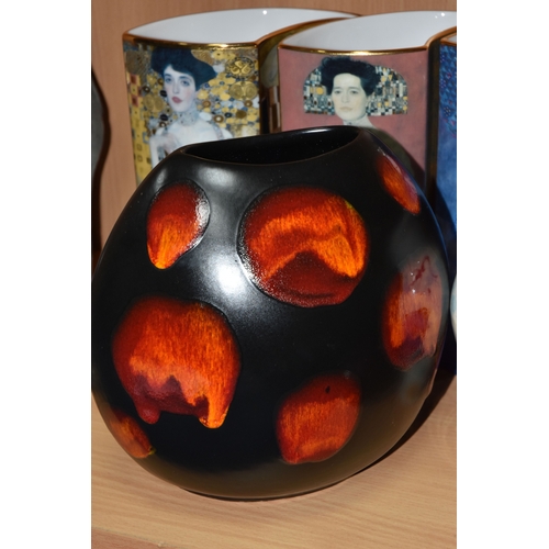 831 - A GROUP OF CERAMICS, comprising three pieces of Poole Pottery: a Galaxy pattern purse vase, height 1... 