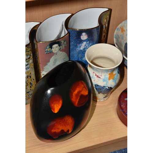 831 - A GROUP OF CERAMICS, comprising three pieces of Poole Pottery: a Galaxy pattern purse vase, height 1... 