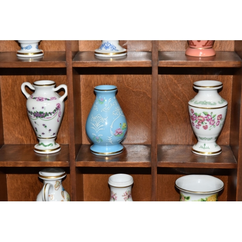 843 - A COLLECTION OF MINIATURE VASES AND PLATES, comprising twenty three miniature plates by various manu... 