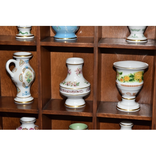 843 - A COLLECTION OF MINIATURE VASES AND PLATES, comprising twenty three miniature plates by various manu... 