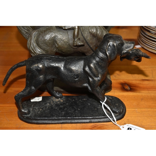 848 - A GROUP OF THREE BRONZED FIGURINES to include a bronzed resin hunter and his gun dog approximately 3... 