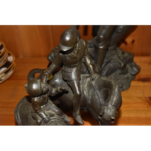 848 - A GROUP OF THREE BRONZED FIGURINES to include a bronzed resin hunter and his gun dog approximately 3... 