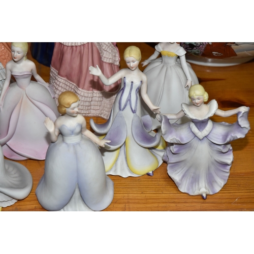 851 - A LARGE GROUP OF BOTH GLAZED AND BISQUE FEMALE FIGURINES to include eleven bisque ladies from the Fr... 