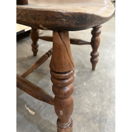 11 - A 19TH CENTURY YEW WOOD AND ELM WINDSOR ARMCHAIR, the hoop back with spindle and pierced splat, on t... 