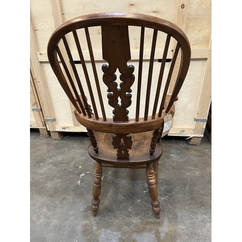 11 - A 19TH CENTURY YEW WOOD AND ELM WINDSOR ARMCHAIR, the hoop back with spindle and pierced splat, on t... 