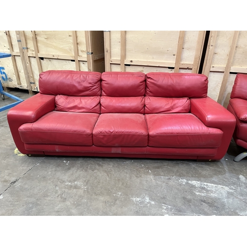 17 - A RED LEATHER THREE SEATER SETTEE, length 245cm x depth 109cm x height 87cm, along with a similar ch... 