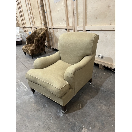 29 - A HOWARD AND SONS STYLE ARMCHAIR, on square turned legs, and chrome casters, width 80cm x depth 104c... 