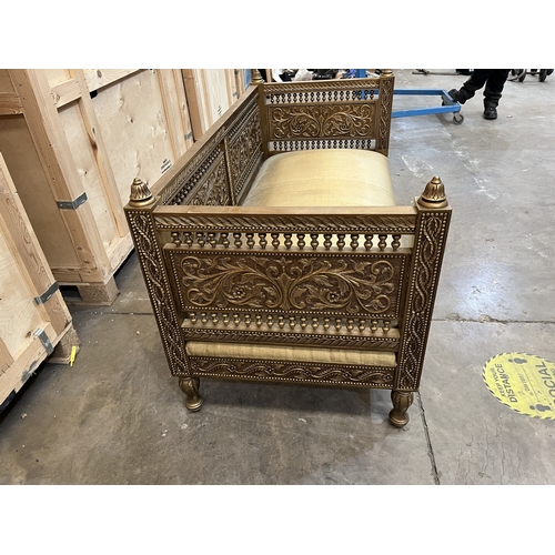 3 - A LATE 20TH CENTURY INDIAN STYLE GILTWOOD DAY BED, carved with foliage decoration throughout, and tu... 