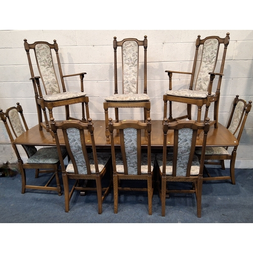 201 - LUCIAN ERCOLANI, AN ERCOL ELM AND BEECH EXTENDING DINING TABLE, with three additional leaves, raised... 