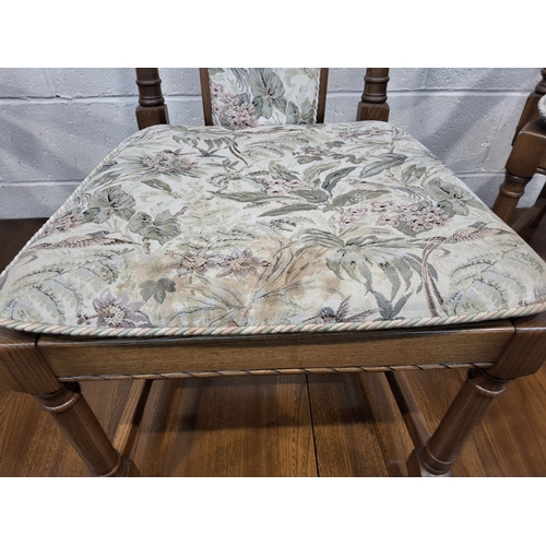 201 - LUCIAN ERCOLANI, AN ERCOL ELM AND BEECH EXTENDING DINING TABLE, with three additional leaves, raised... 