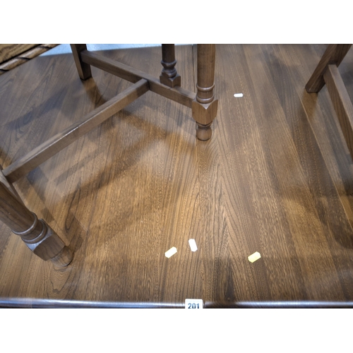 201 - LUCIAN ERCOLANI, AN ERCOL ELM AND BEECH EXTENDING DINING TABLE, with three additional leaves, raised... 
