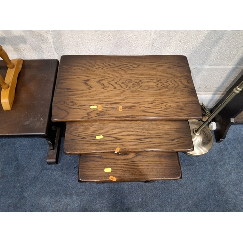 310 - A SELECTION OF OCCASIONAL FURNITURE, to include an oak coffee table, a nest of three tables, a towel... 