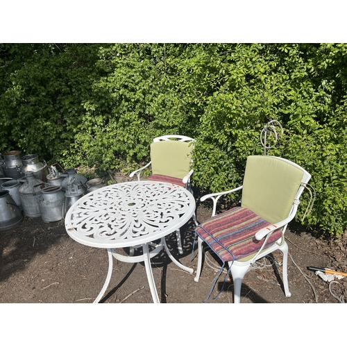 4 - A CAST ALUMINIUM GARDEN TABLE WITH TWO SIMILAR CHAIRS, all have pierced fretwork detail, table, diam... 