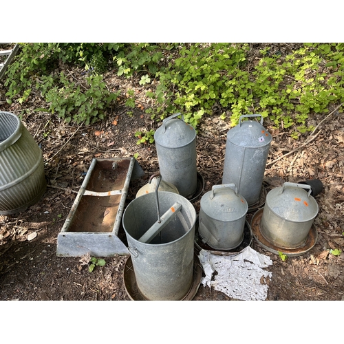 6 - A COLLECTION OF GALVANISED FEED HOPPERS AND A TROUGH, including Eltex hoppers, the tallest height 56... 