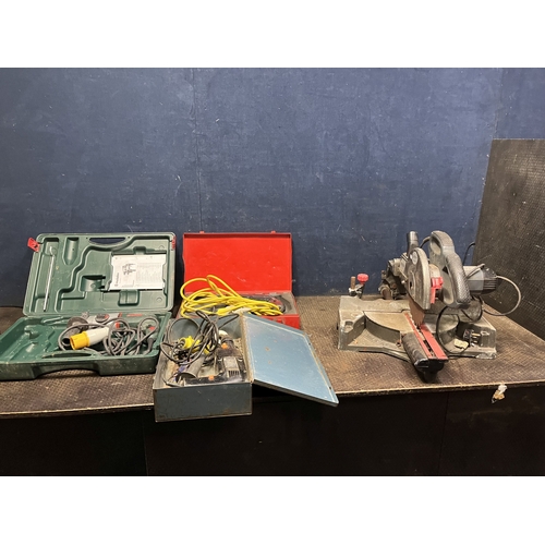 82 - THREE 110 VOLT ROTARY HAMMER DRILLS AND A 240 VOLT PERFORMANCE POWER COMPOUND MITRE SAW comprising a... 