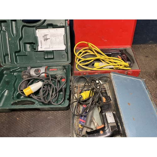 82 - THREE 110 VOLT ROTARY HAMMER DRILLS AND A 240 VOLT PERFORMANCE POWER COMPOUND MITRE SAW comprising a... 