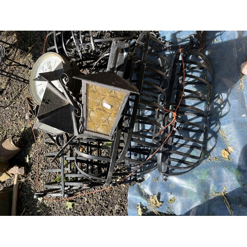 12 - A COLLECTION OF GARDEN METALWARE, including eleven hanging baskets, wall lamps, bracketed wall clock... 